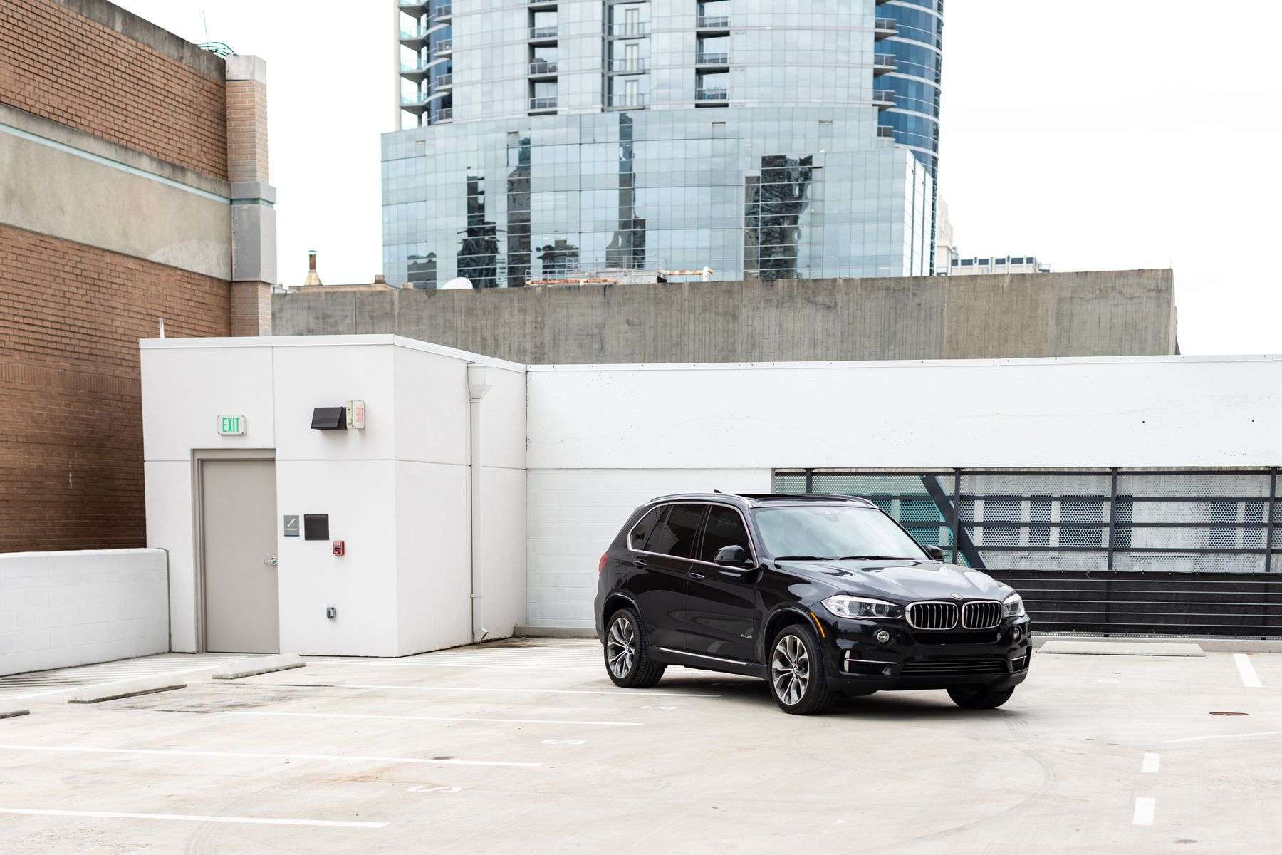 Black SUV parked outside a building
