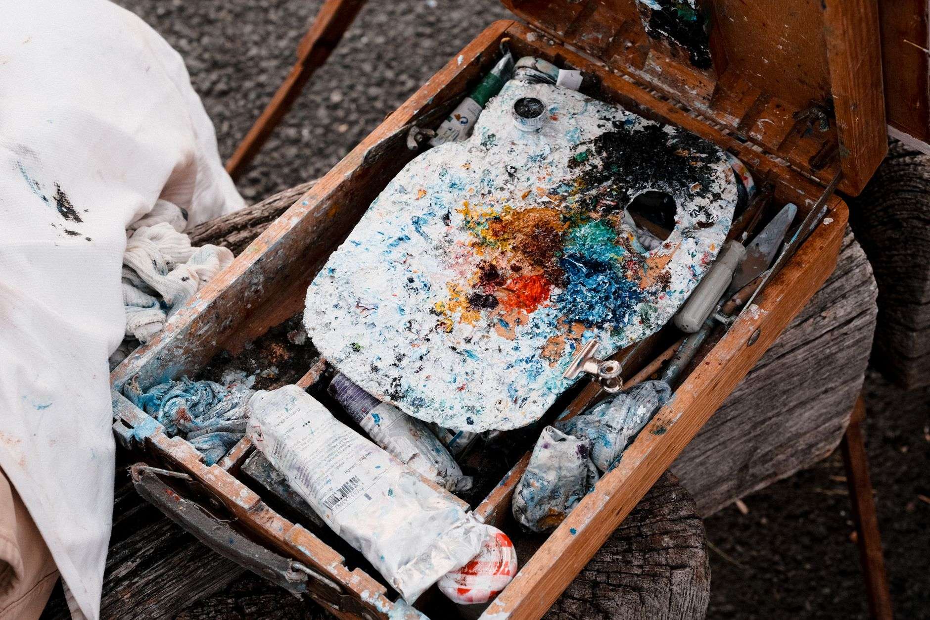 Colorful melted wax paint being applied to a painting surface