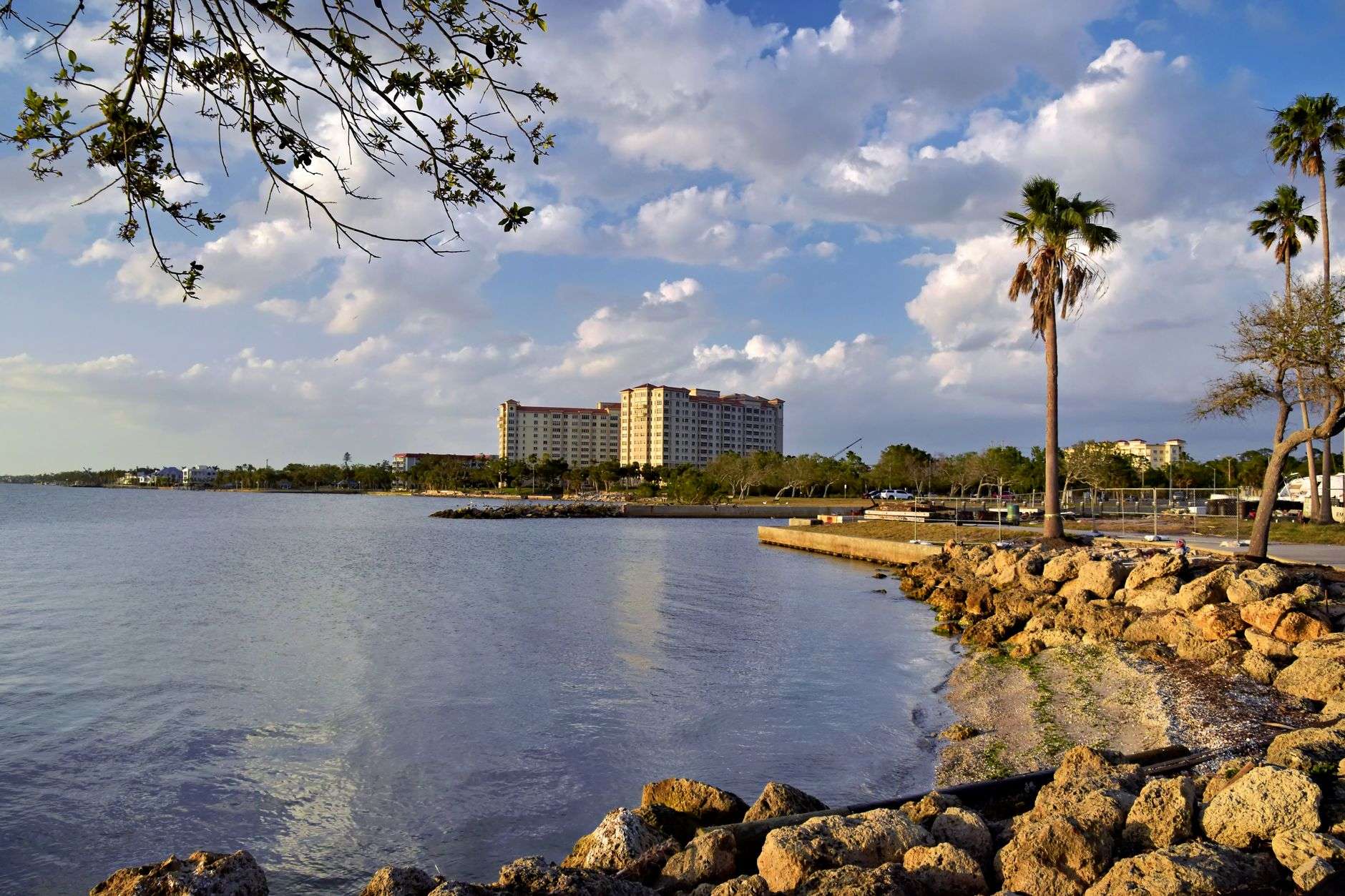 A public park along a bay shoreline with walking paths