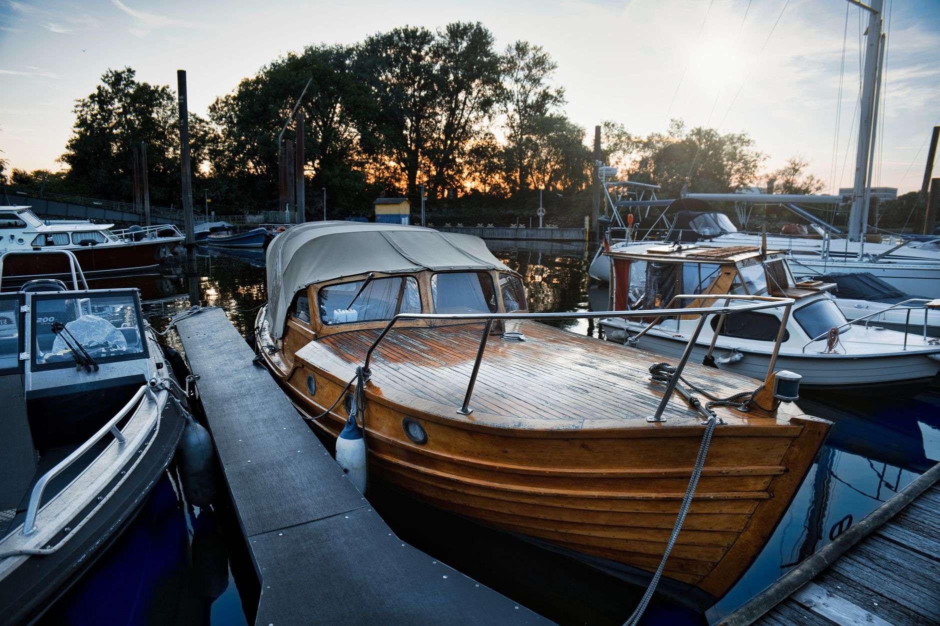 Classic wooden boat moored on calm water