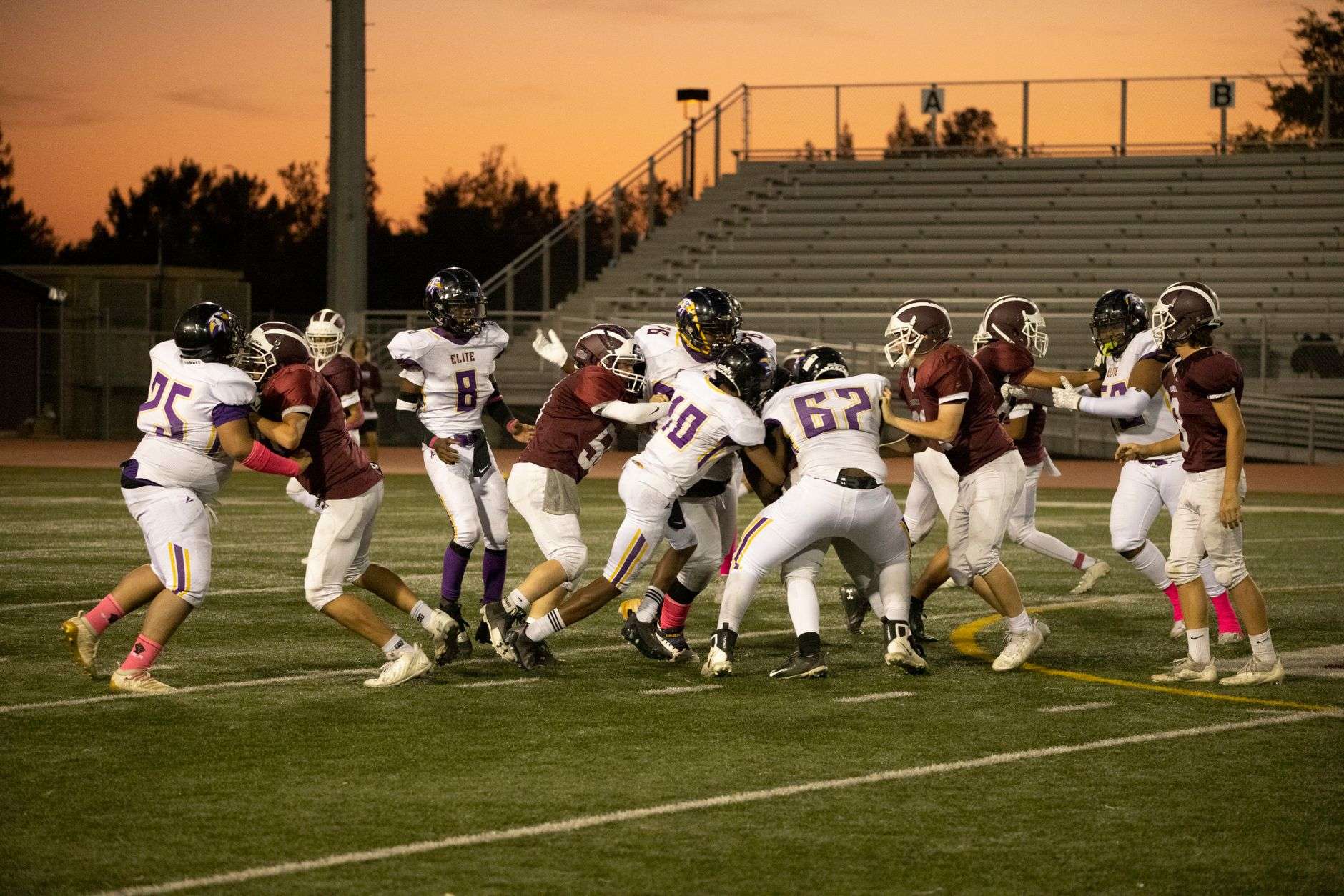 High school football game under stadium lights, illustrating Citronelle's win over LeFlore