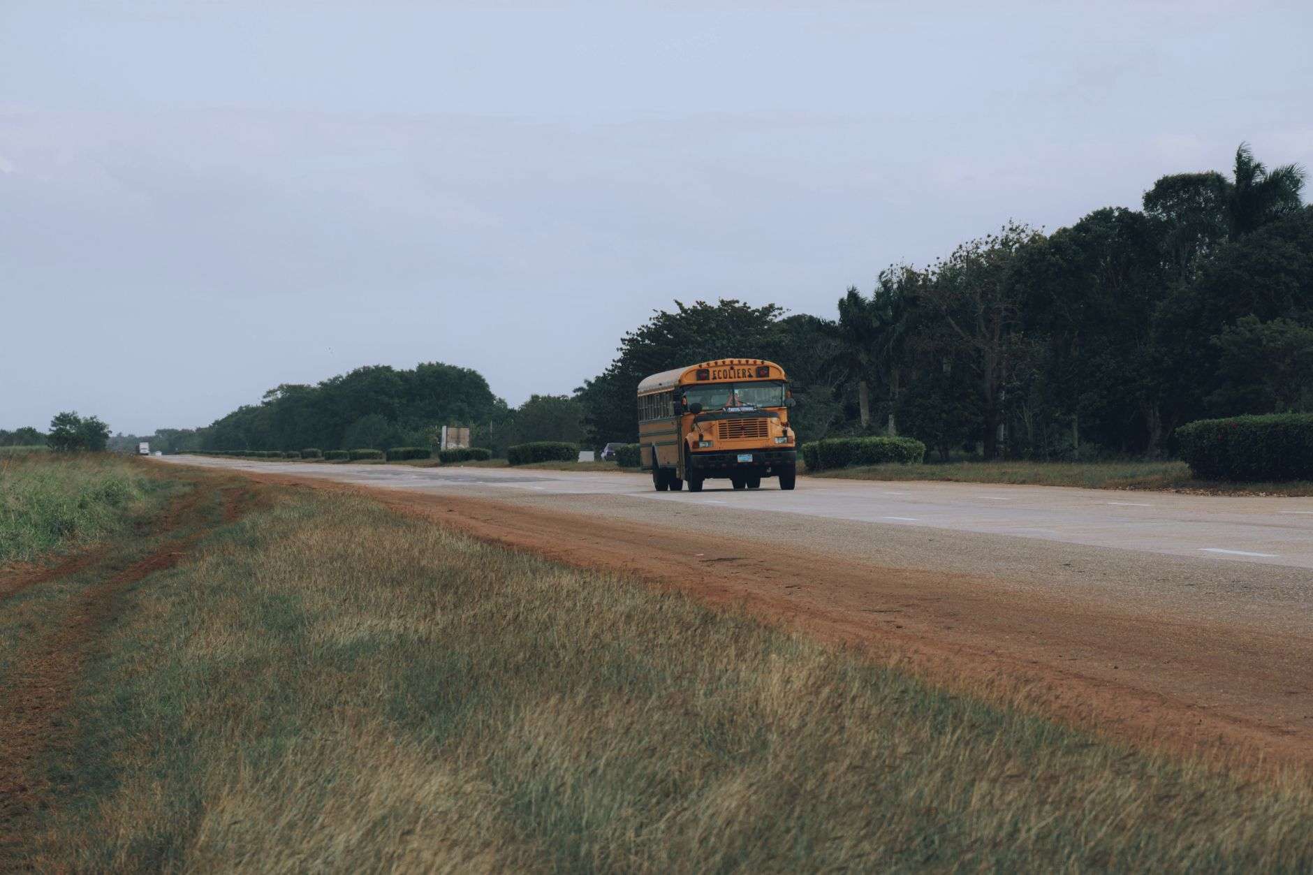 Yellow school bus on a rural road