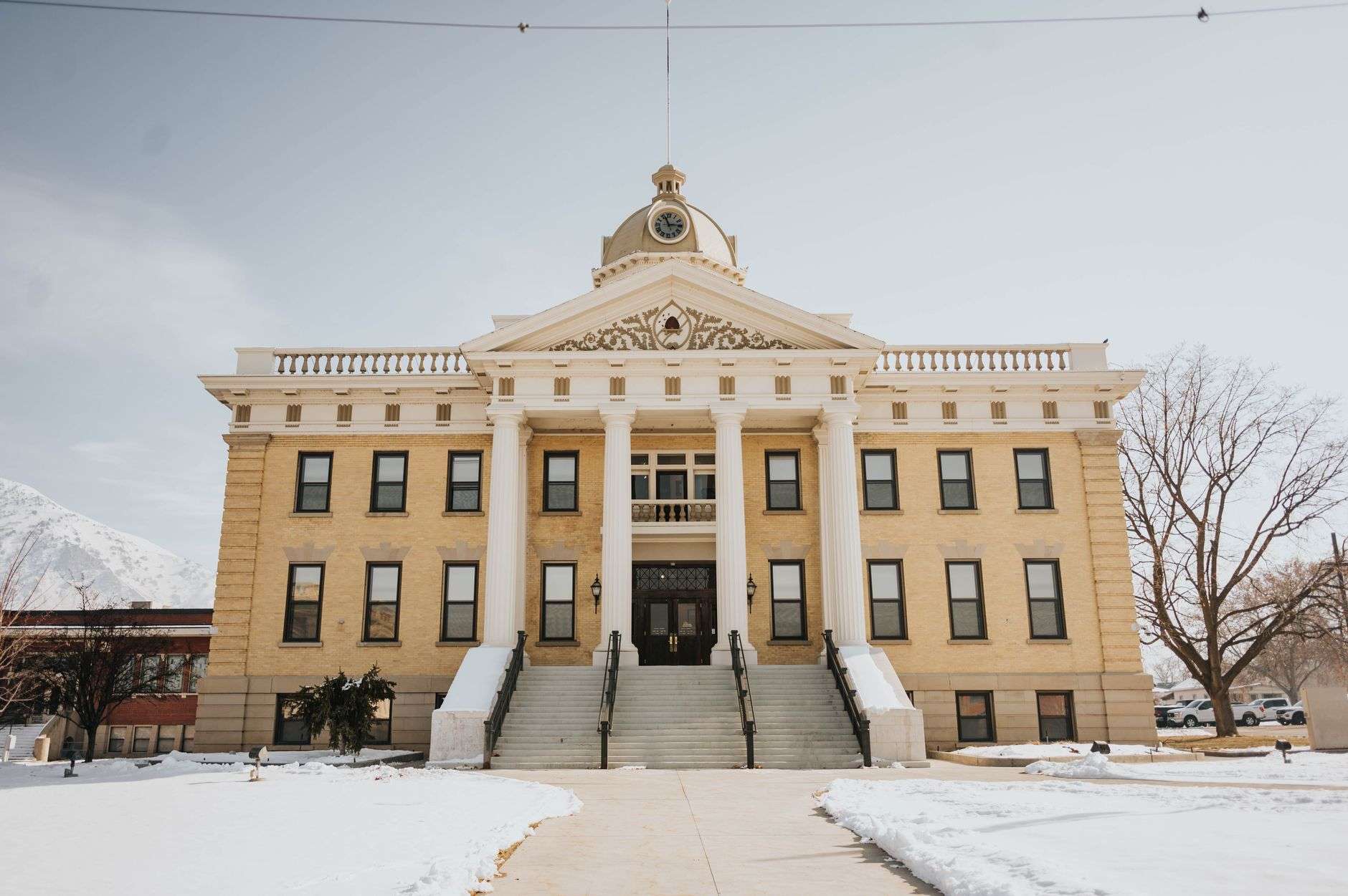 A county courthouse building in a small town, illustrating county government budget deliberations