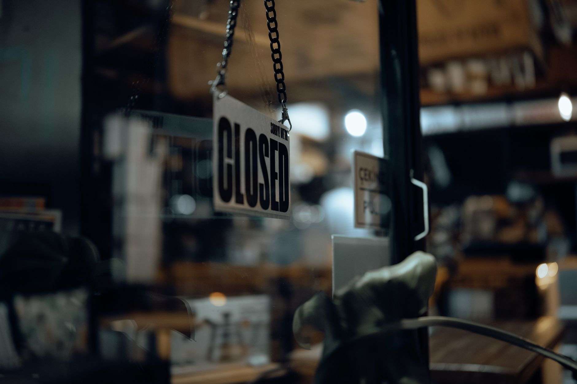 A closed commercial storefront at night, illustrating the setting of an overnight business break-in investigation