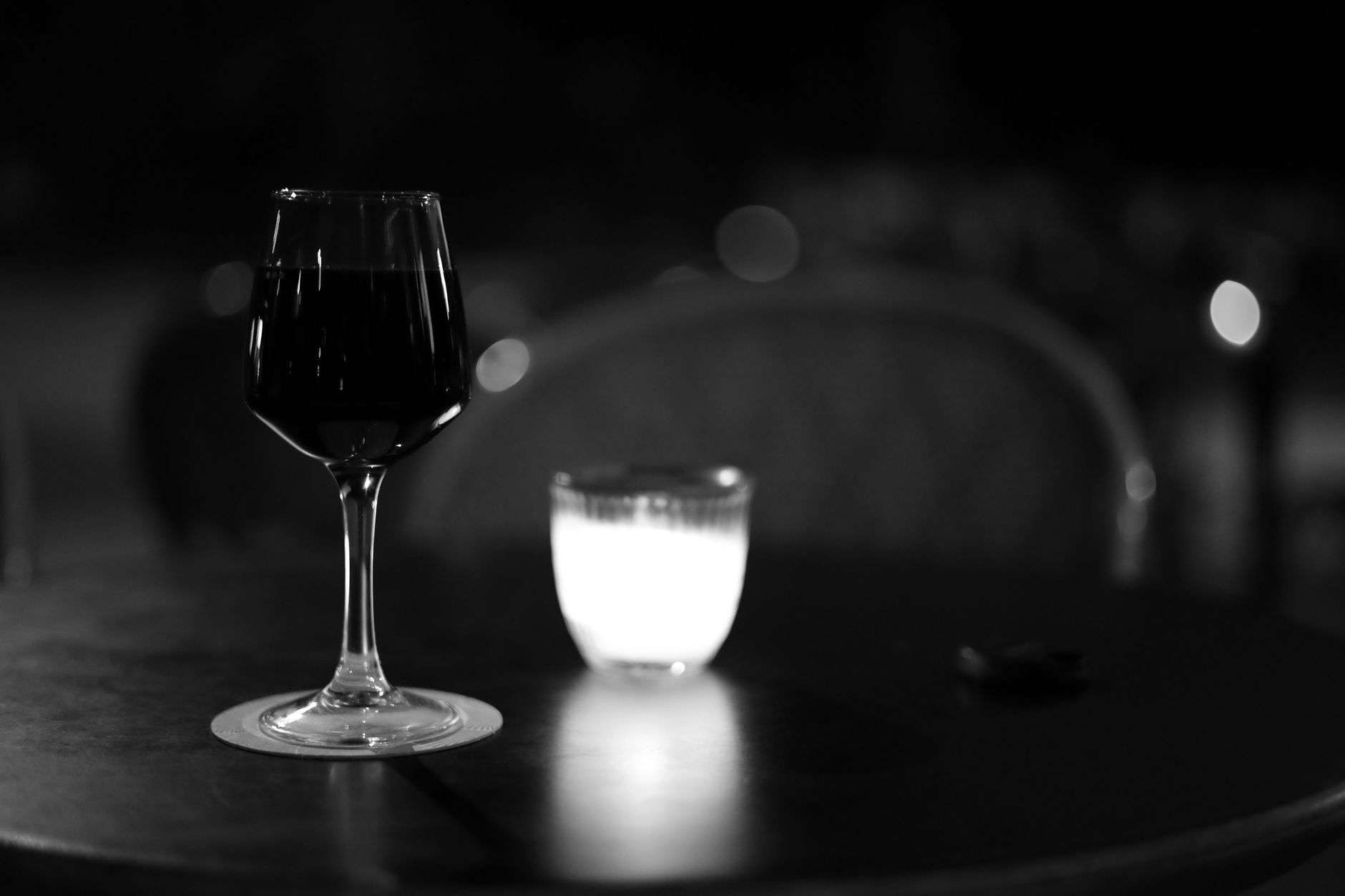 A candlelit table set for dinner in a bistro