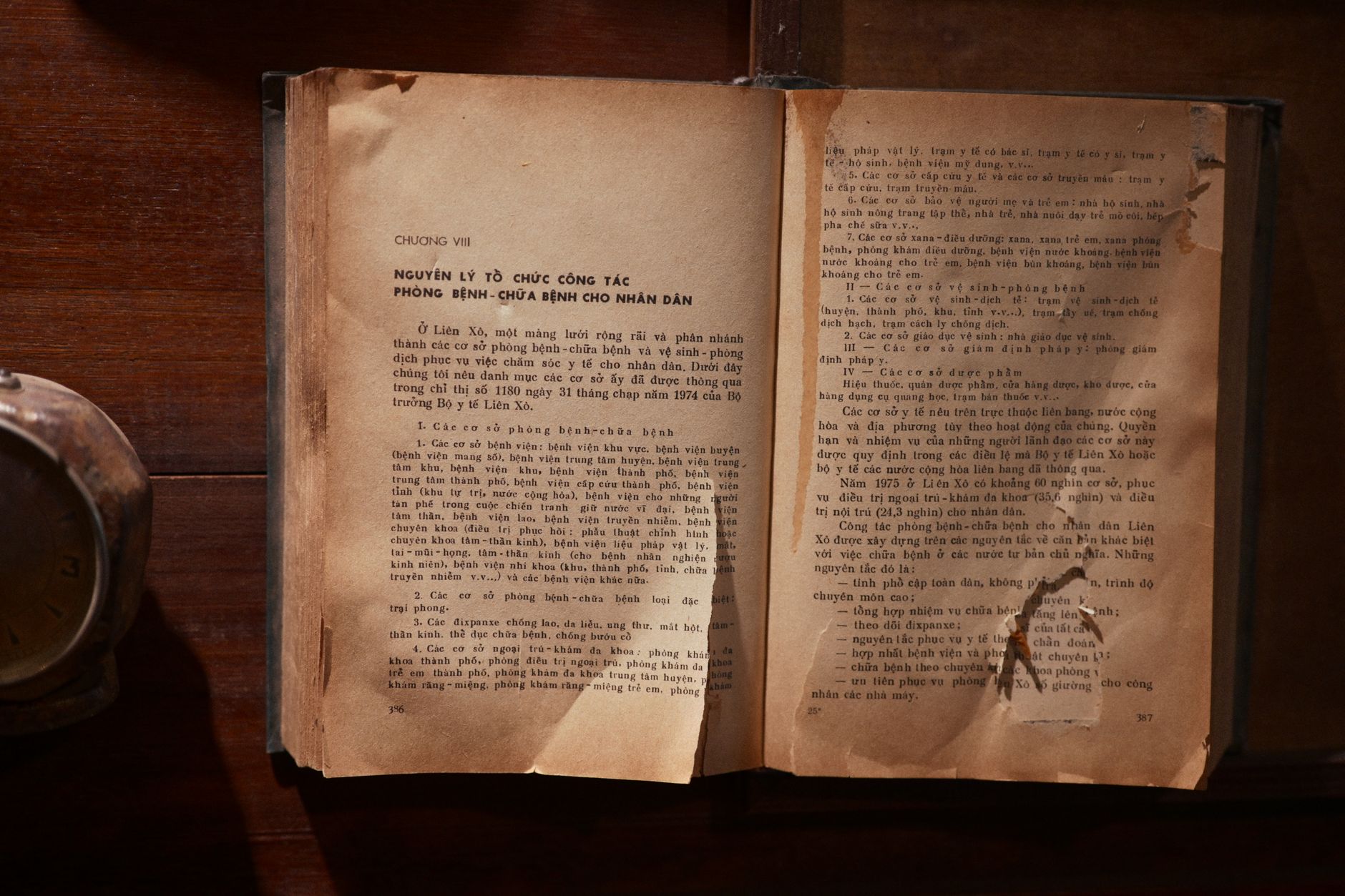 A hardcover book resting on a wooden table