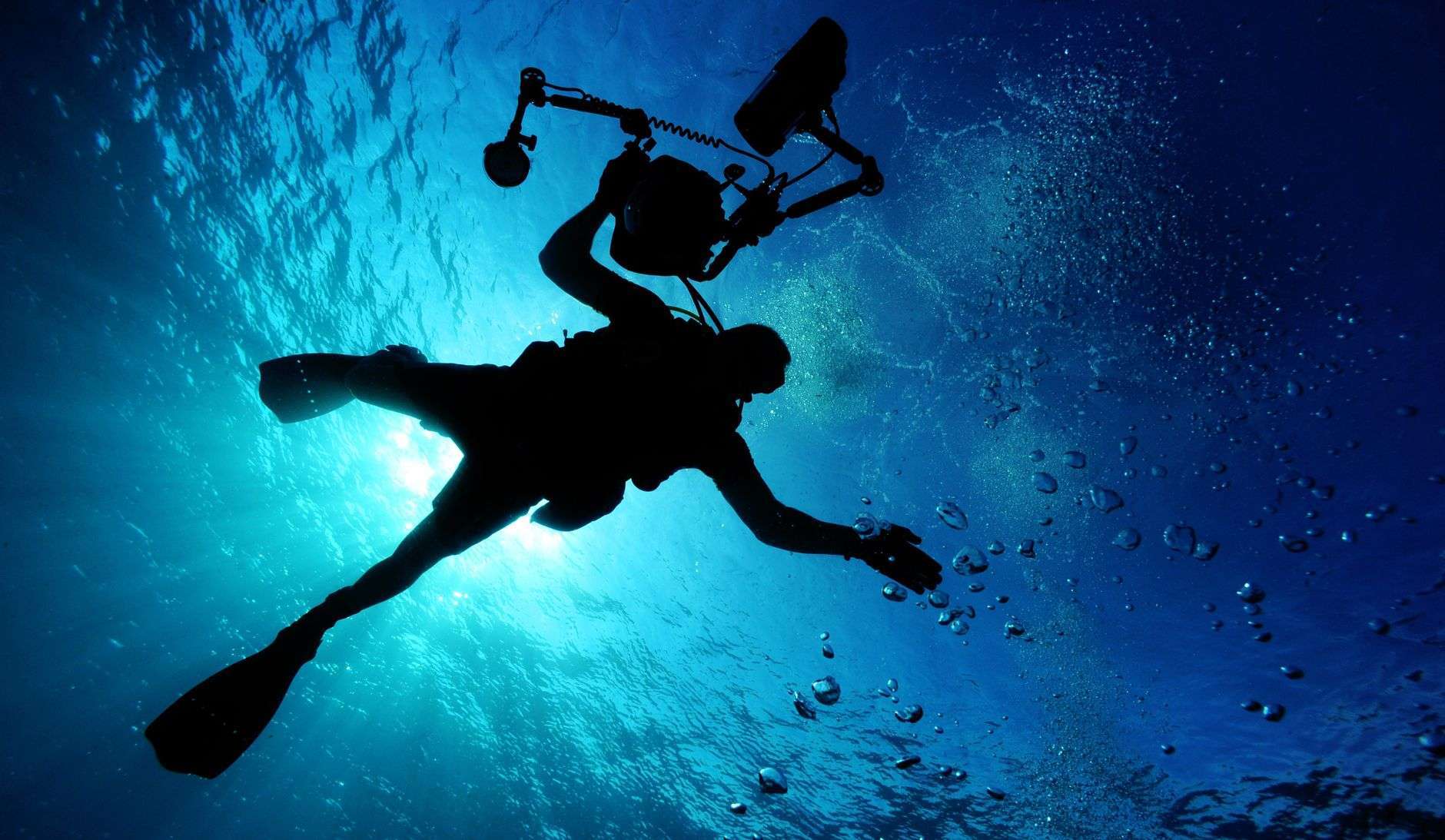 A scuba diver underwater, illustrating a volunteer marine debris removal cleanup