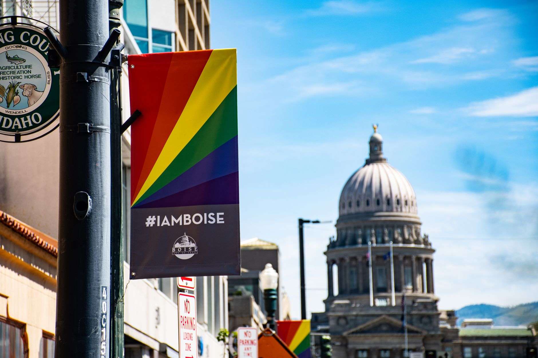 Banners hanging from light poles along a downtown city street