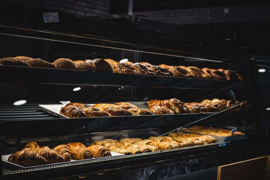 Croissants and pastries displayed at a bakery counter