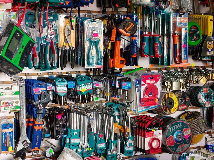 Shelves and aisles stocked with tools in a hardware store