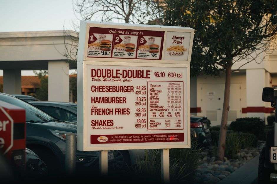 Hand-pressed hamburgers with crinkle-cut fries at a classic drive-in