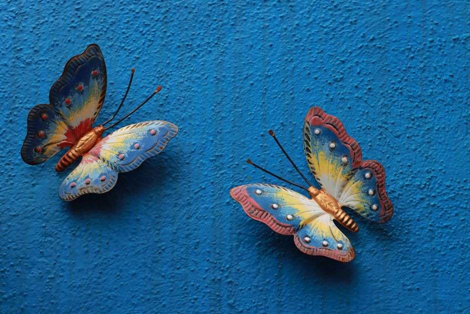 A colorful butterfly rendered in mixed media artwork
