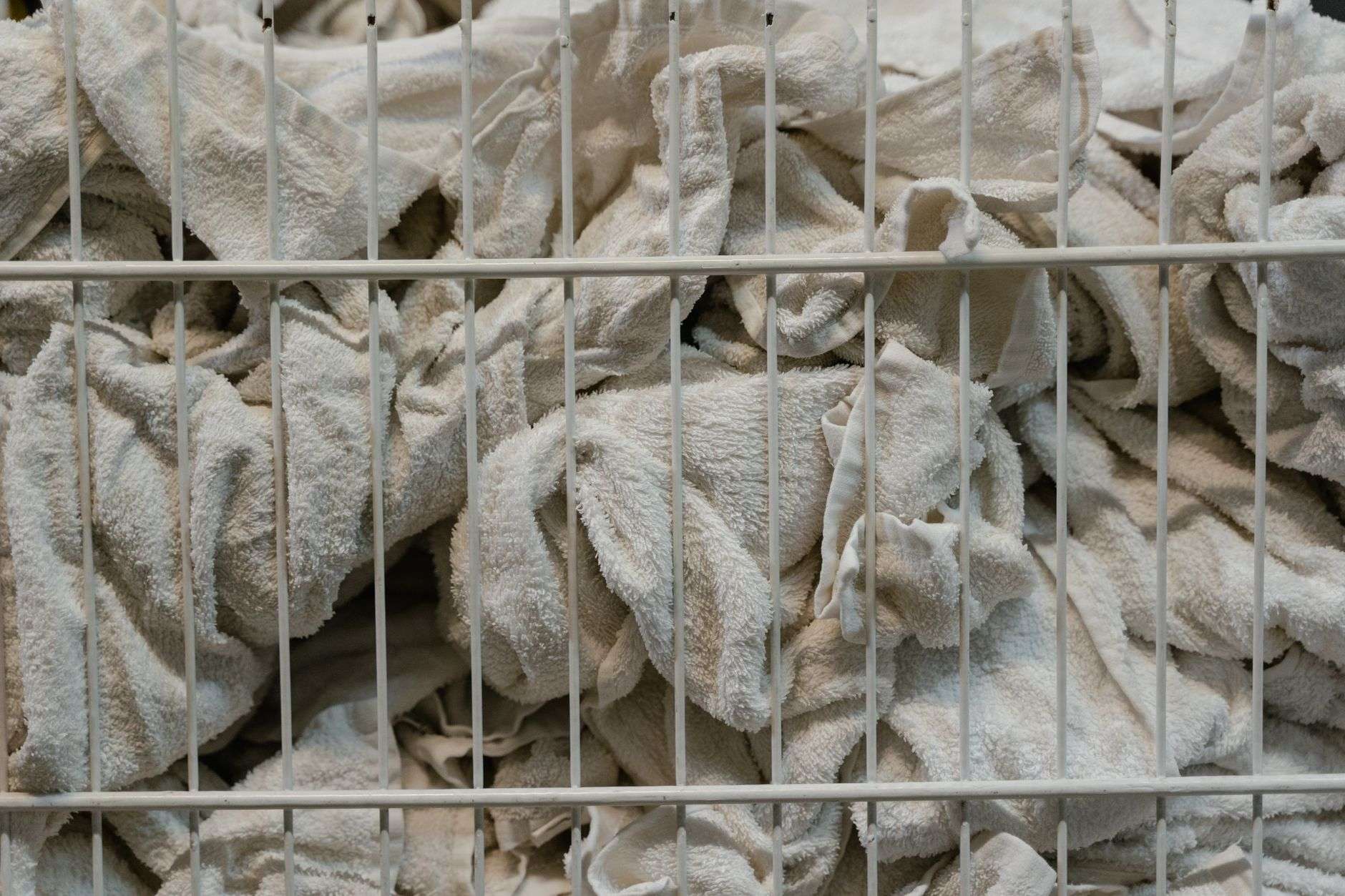 Neatly folded stacks of white towels