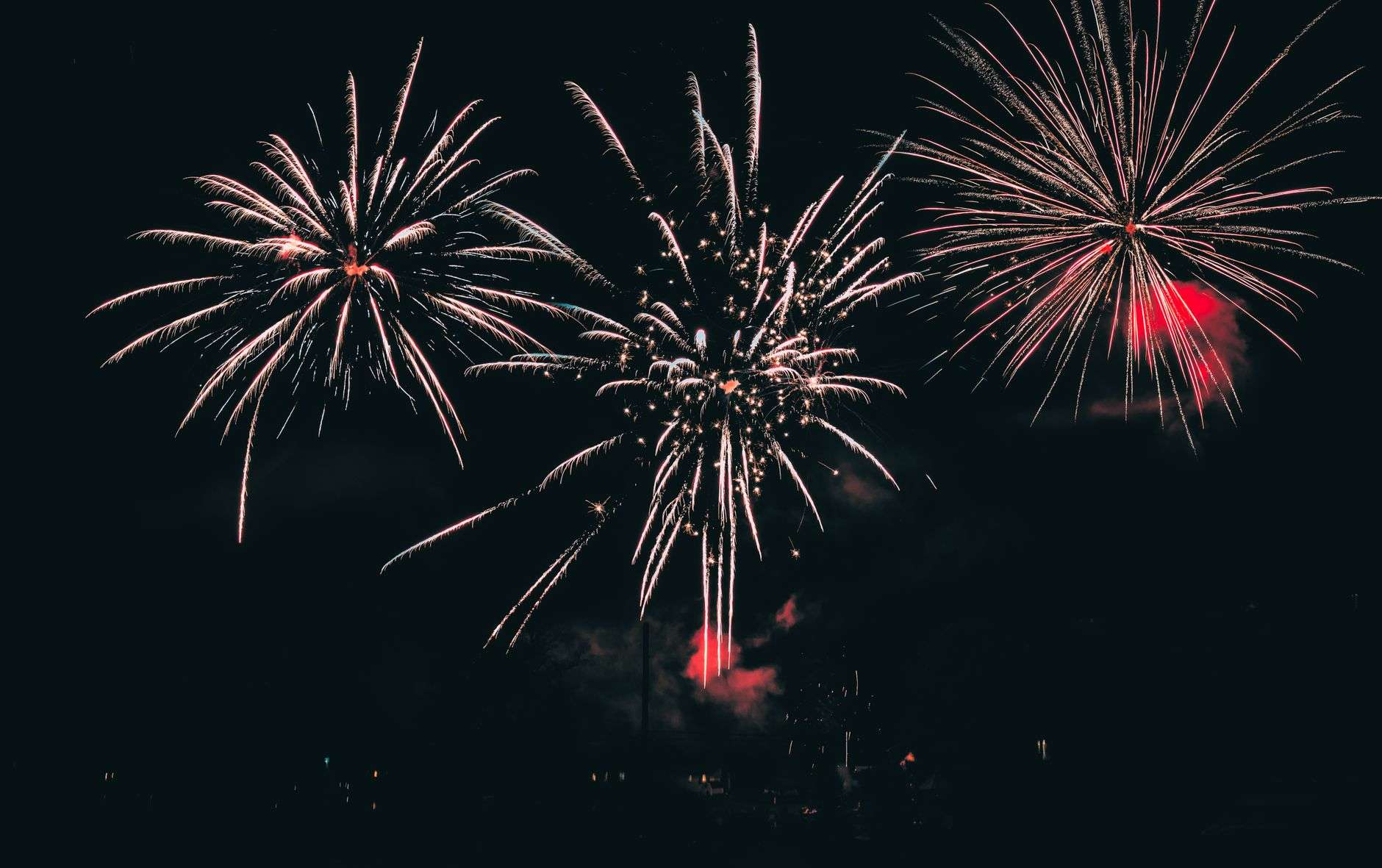 Fireworks bursting in a dark night sky