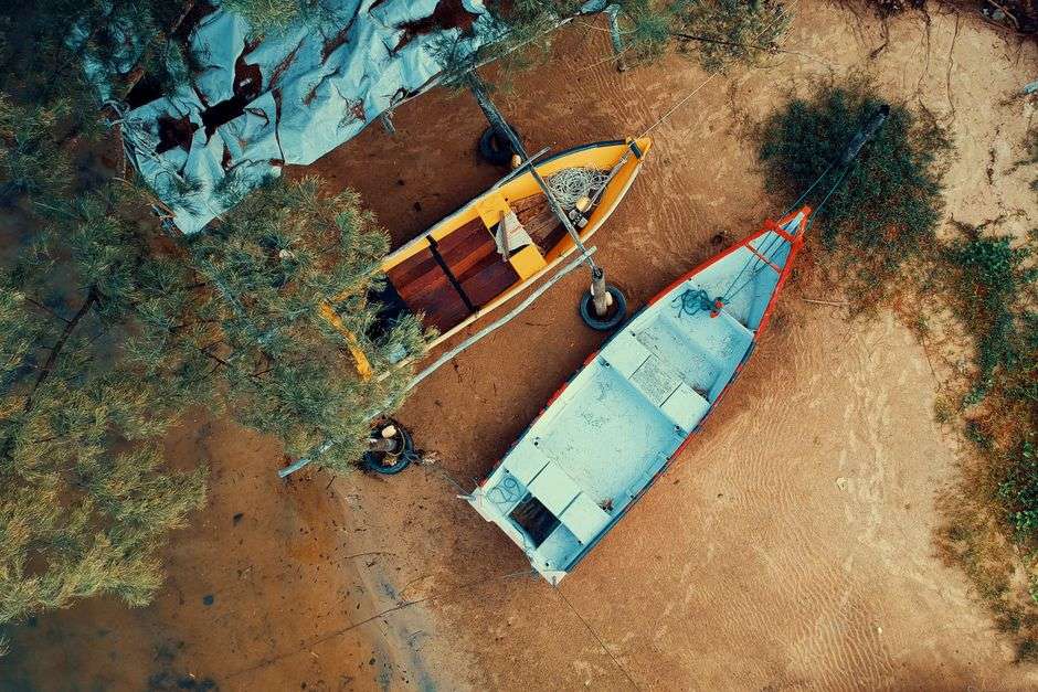 Vintage wooden fishing skiff resting on calm coastal bayou waters