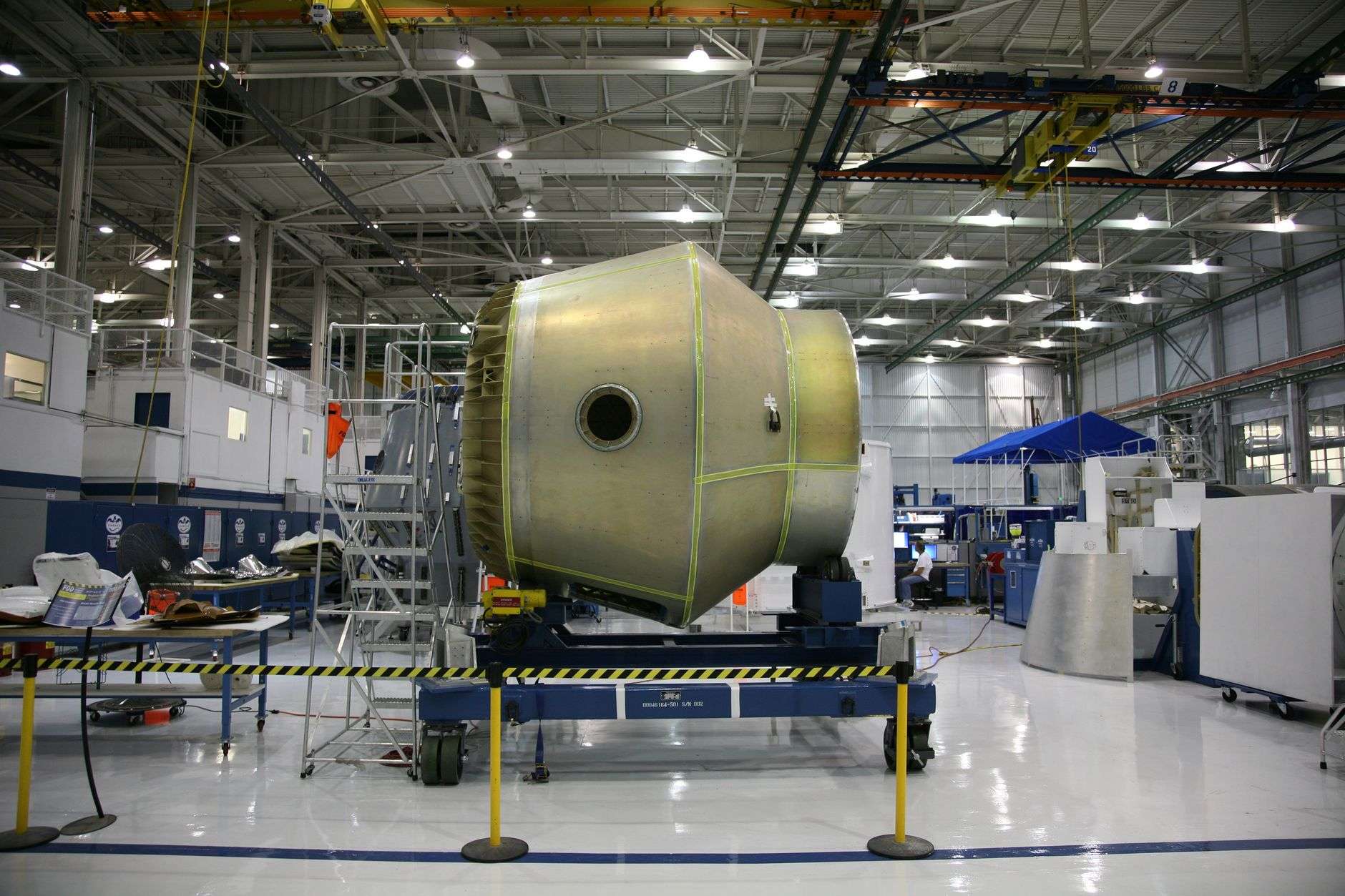 Commercial aircraft under assembly in a manufacturing facility