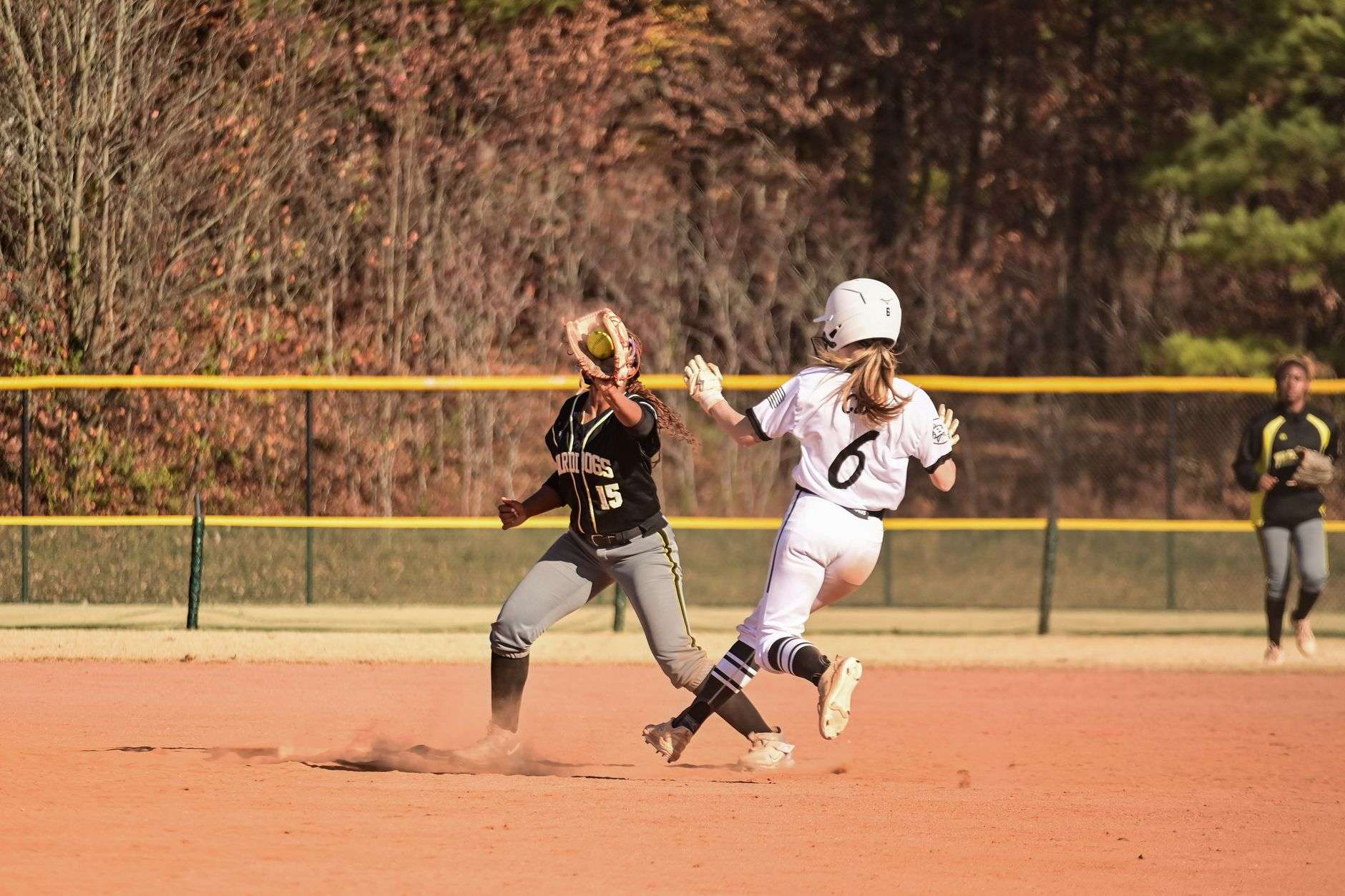 Softball pitcher delivering a pitch during a game