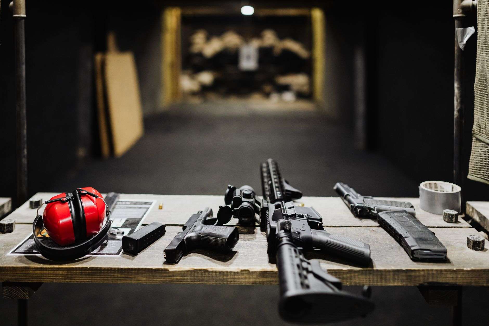 Firearm and shooting accessories displayed at a range