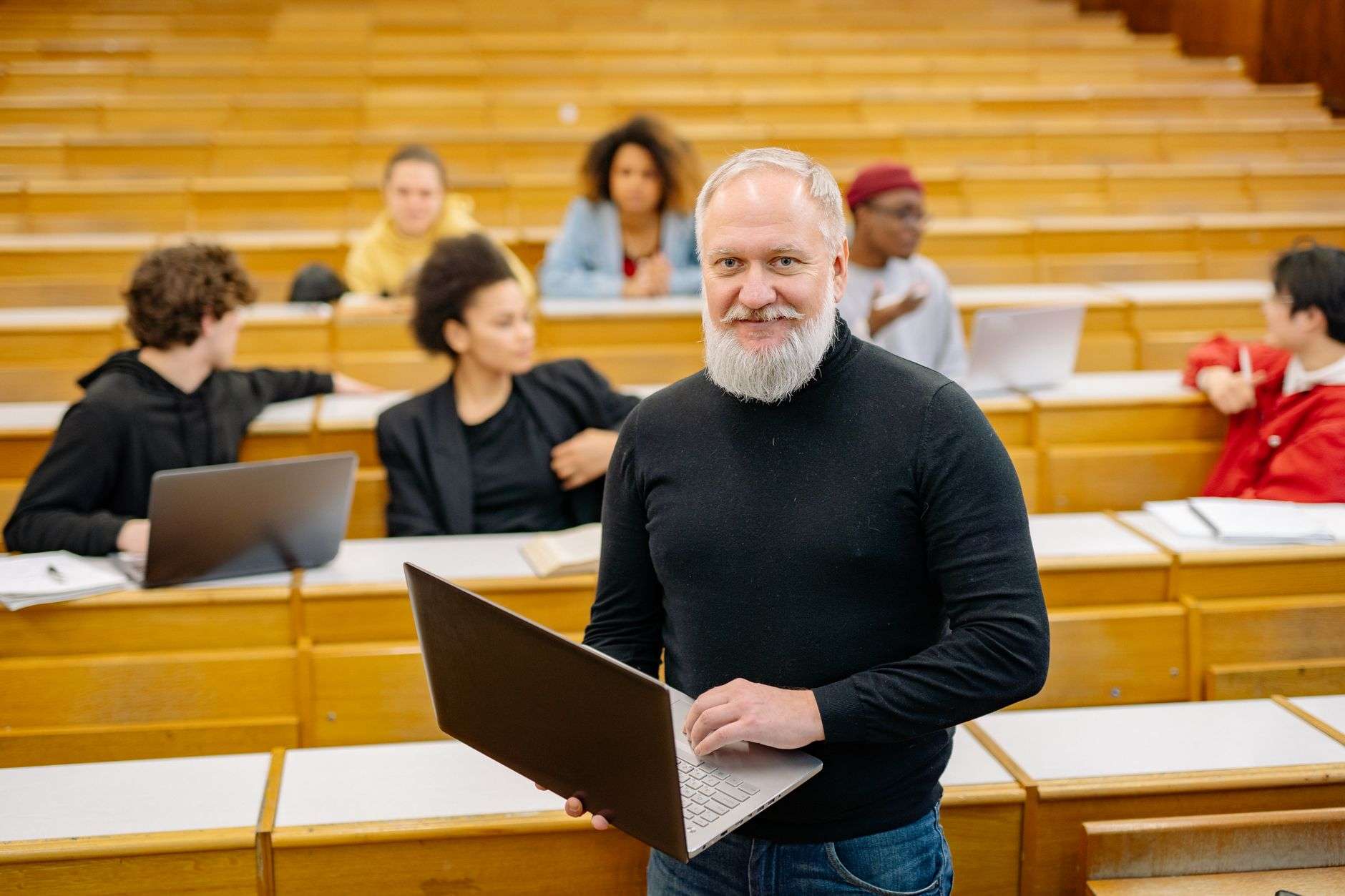 Adult students seated at laptops during an instructor-led community computer class