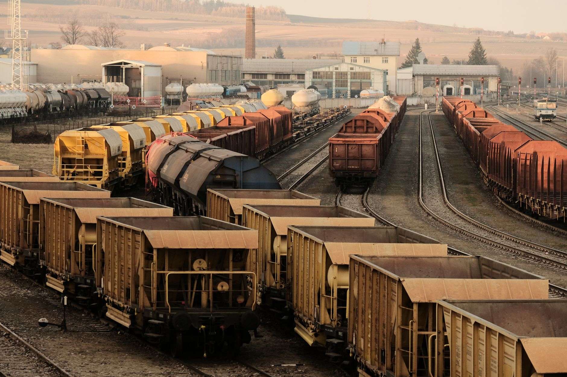 Freight rail cars lined up at a port terminal, illustrating rail connections that serve seaport cargo