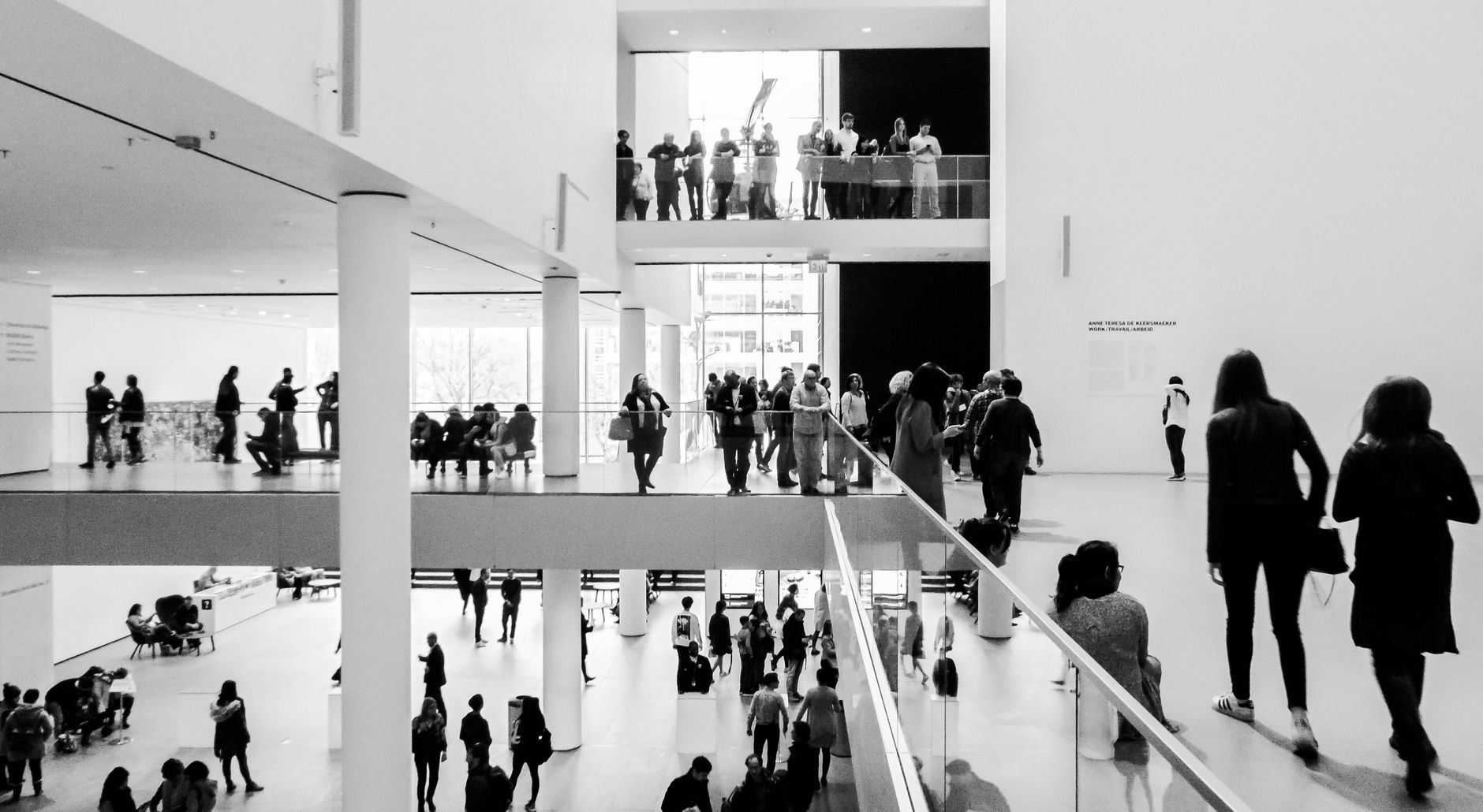 Bright art museum gallery with framed works on the walls
