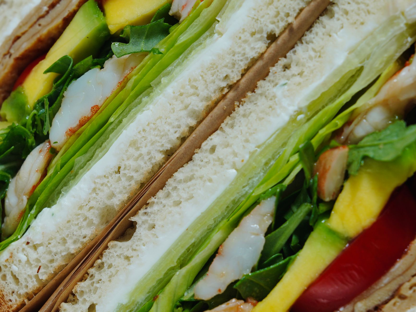 Fried shrimp po-boy on French bread with lettuce and tomato