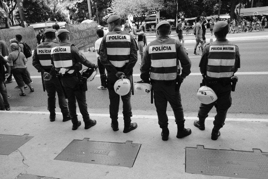 Portable security barriers blocking a street closed to traffic for a crowded outdoor festival