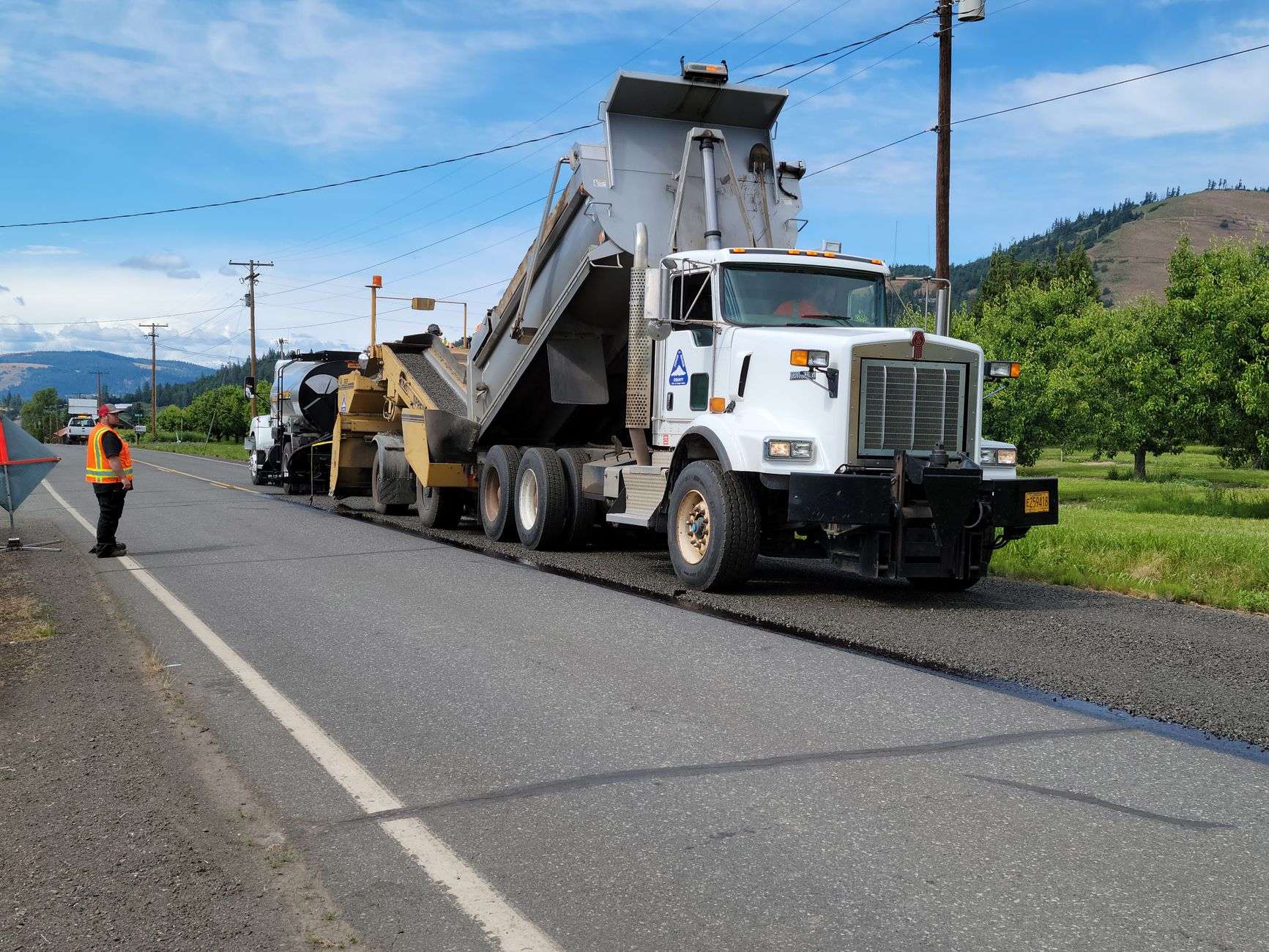 Paving equipment and crew working on road construction
