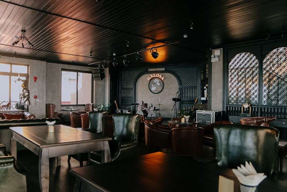 Interior of a historic Gulf Coast bar and restaurant with a music stage