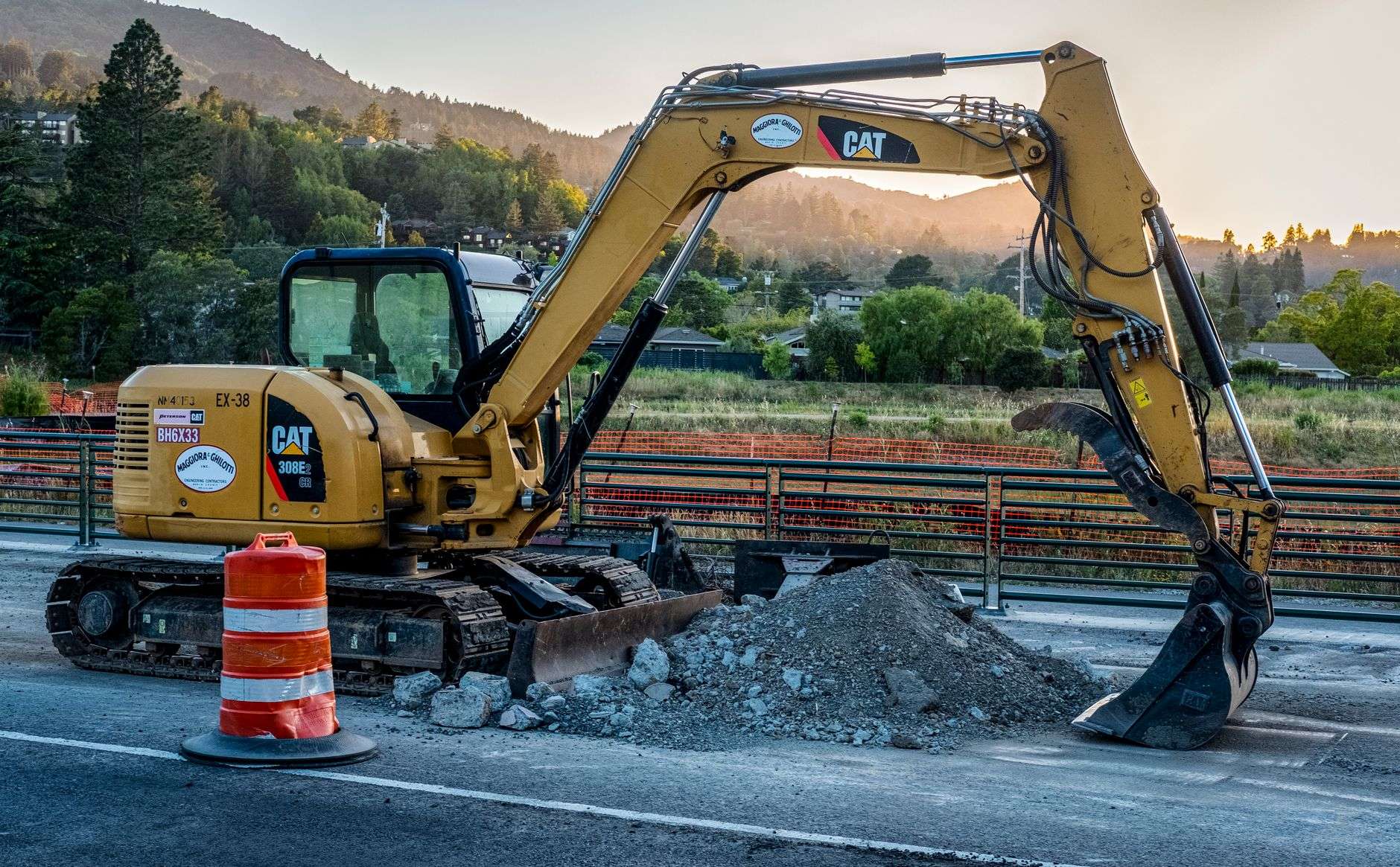 An excavator working at a road construction site
