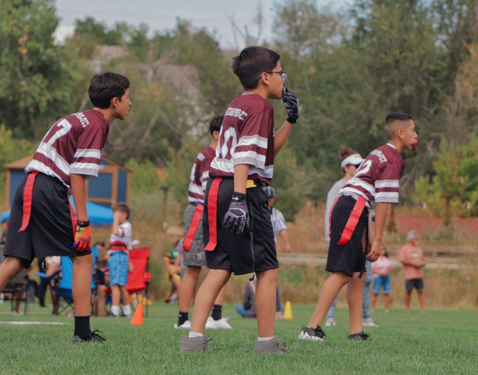 Players on a flag football field, illustrating a growing high school sport