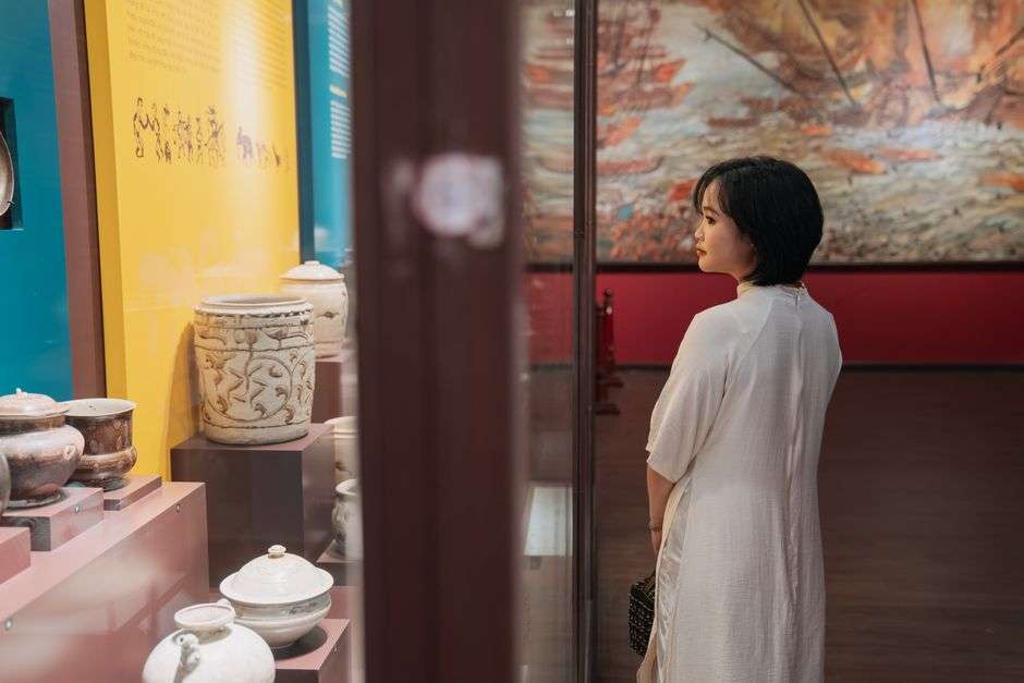 History museum gallery with artifacts in glass display cases