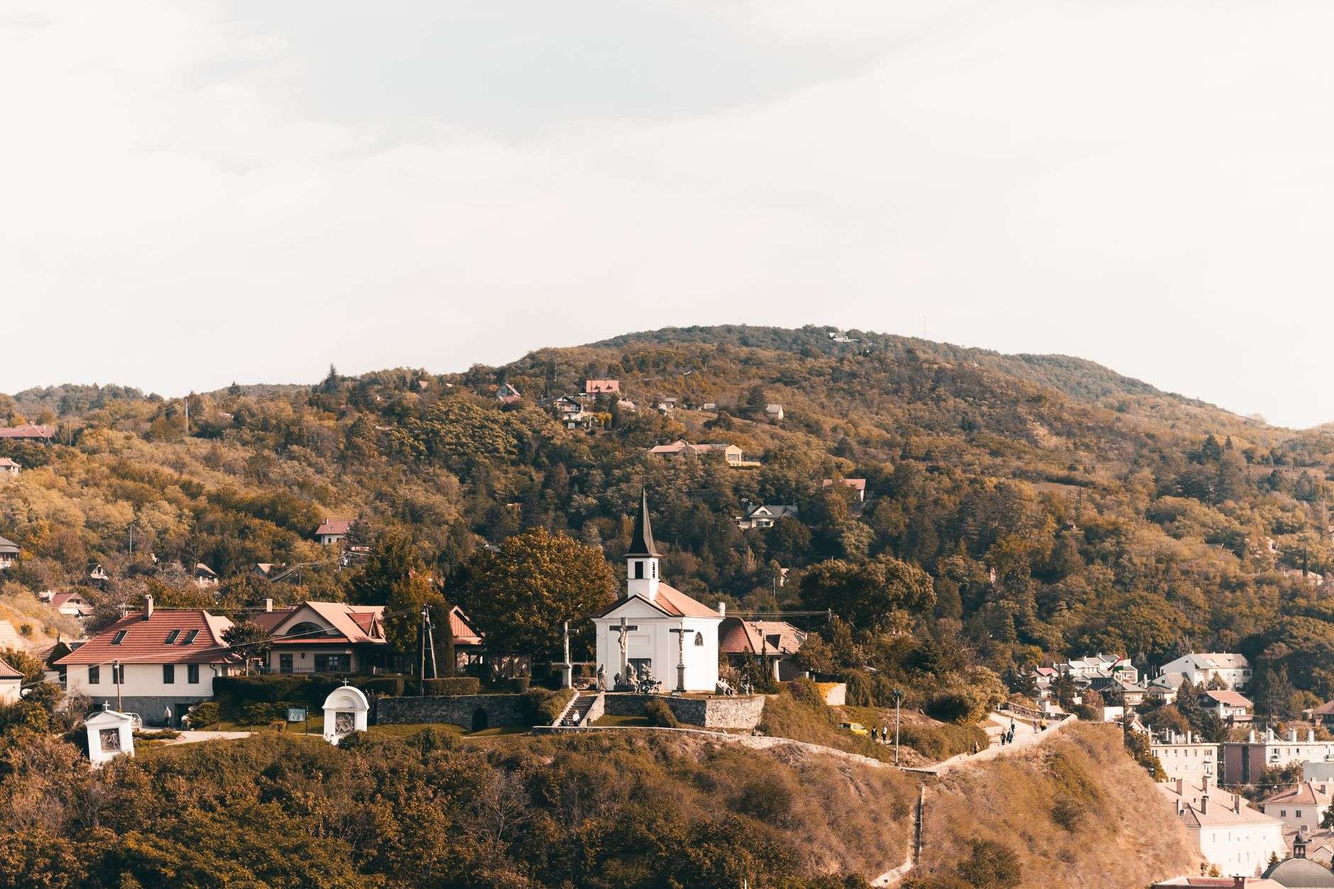 Small rural church building on a grassy hillside