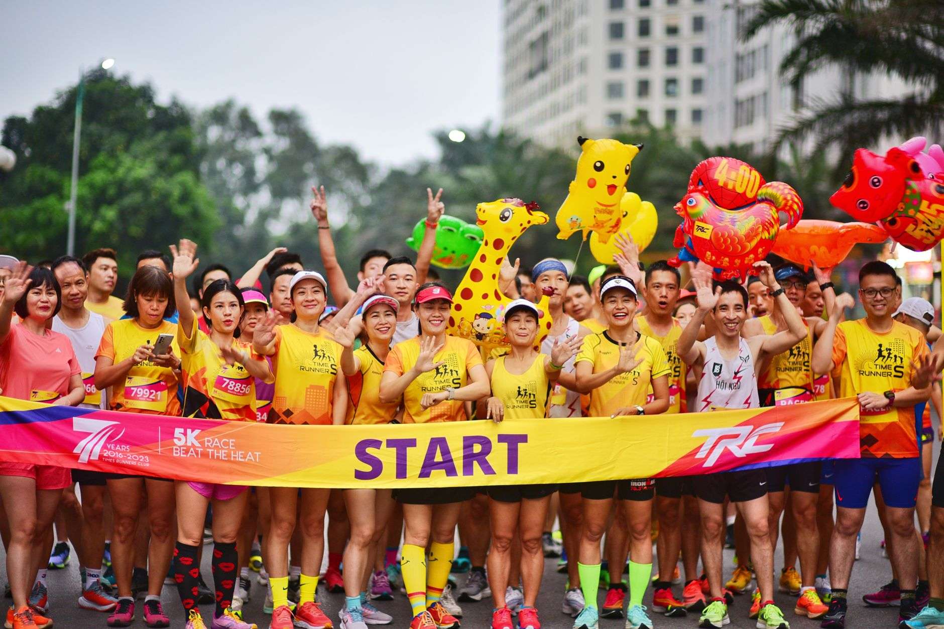 Runners lined up at the start of a charity road race
