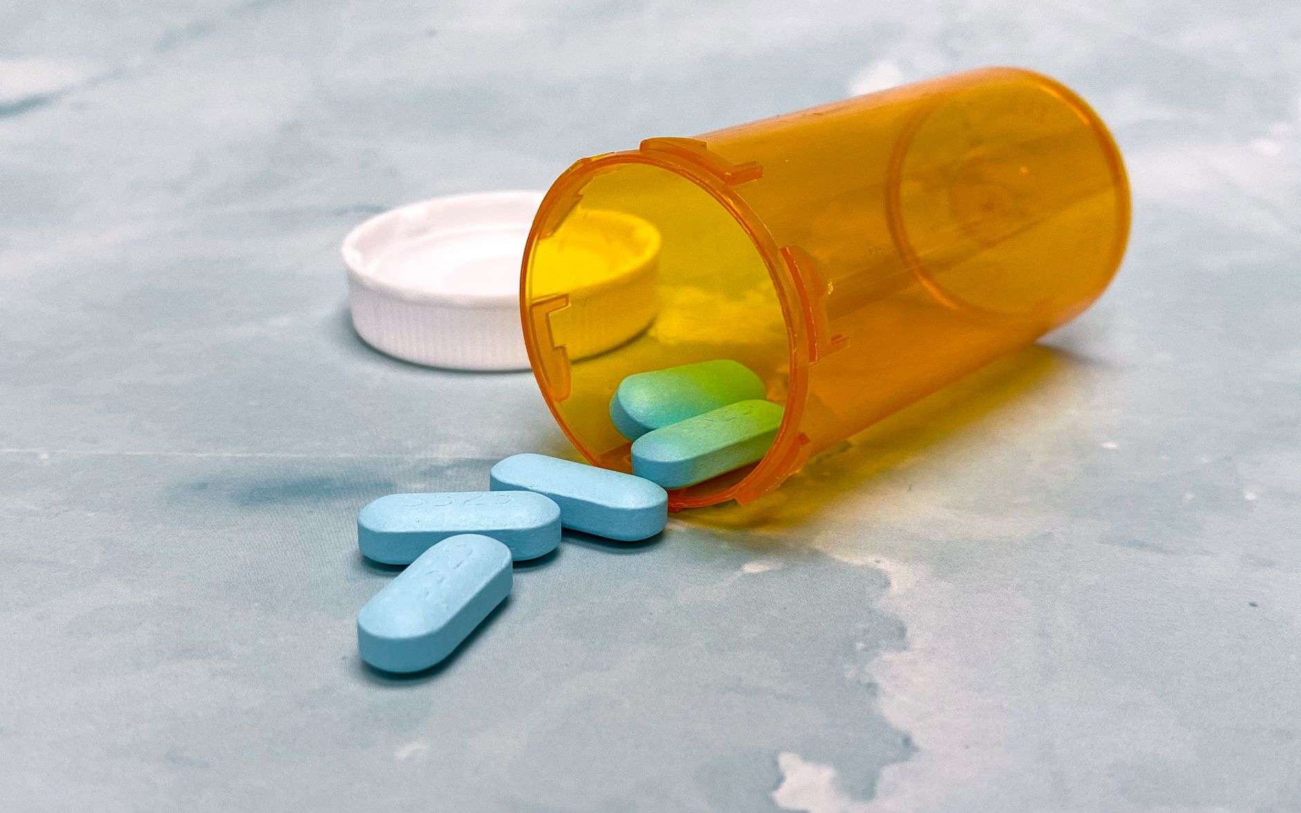 Household medication bottles, illustrating the importance of securing medicines to reduce access risk for children