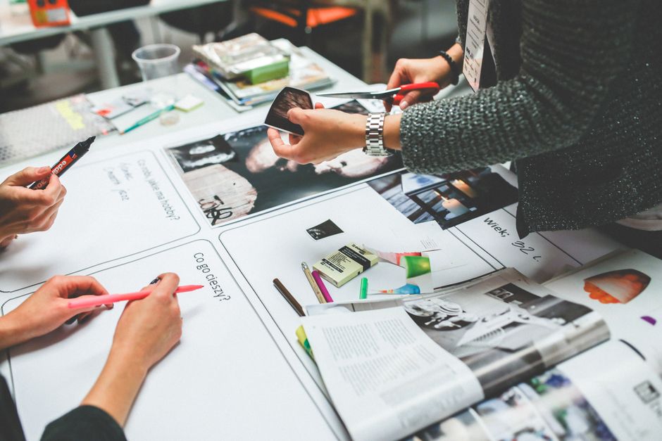 A creative team collaborating at a design and advertising agency office
