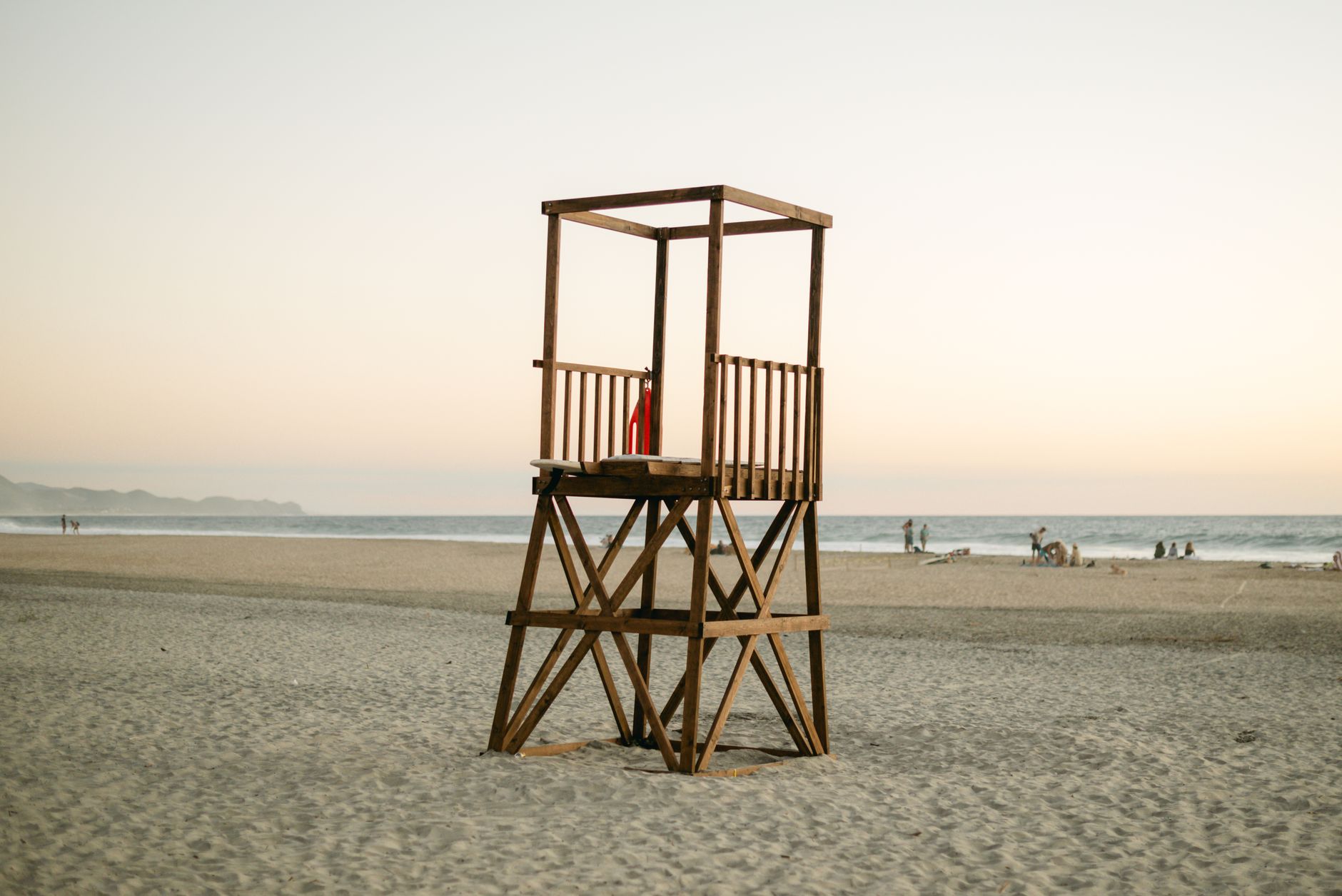 A lifeguard tower overlooking a sandy Gulf Coast beach