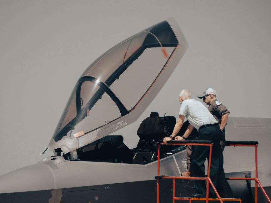 Engineers developing military technology in a defense contractor facility