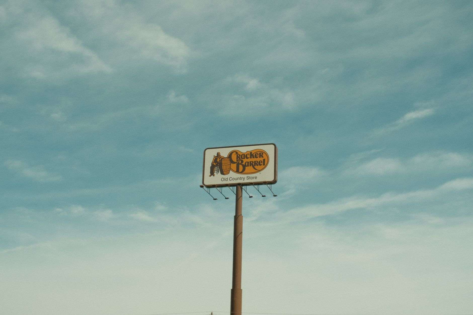 Weathered general store along a quiet rural road surrounded by pine trees in the Deep South