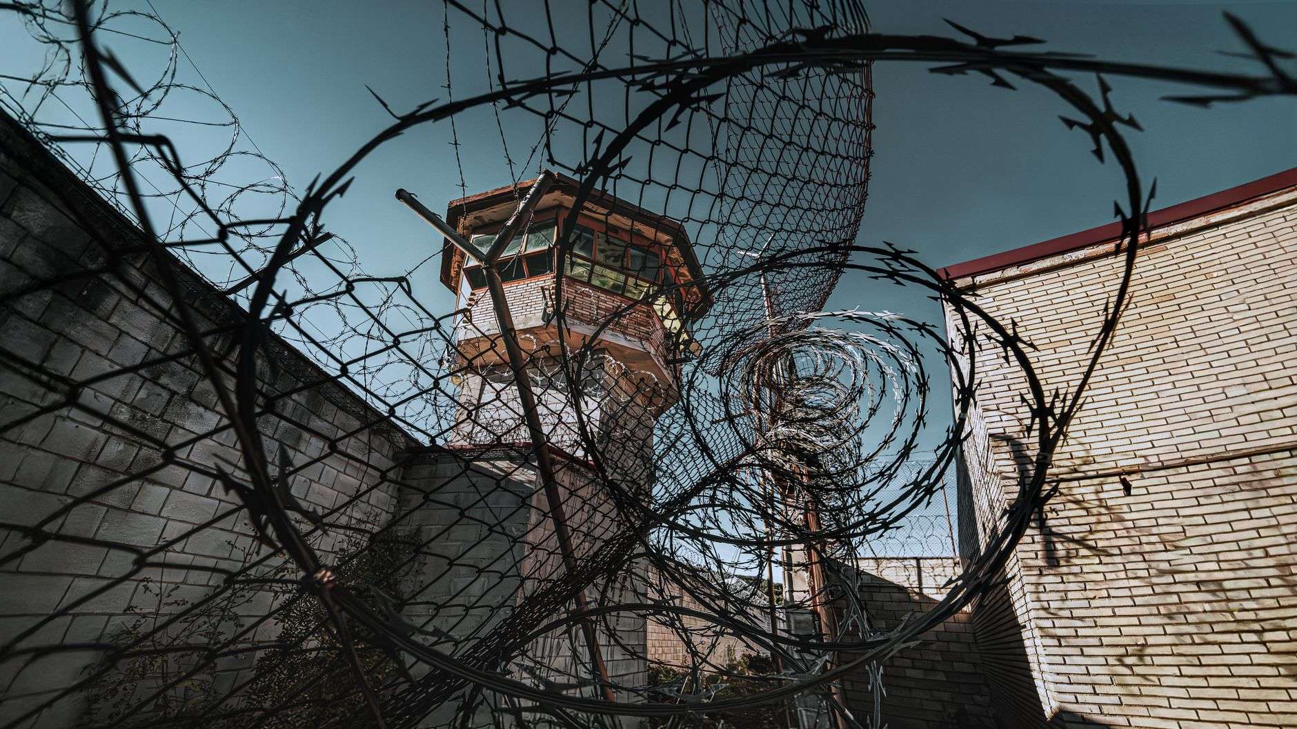 Prison perimeter fence with razor wire