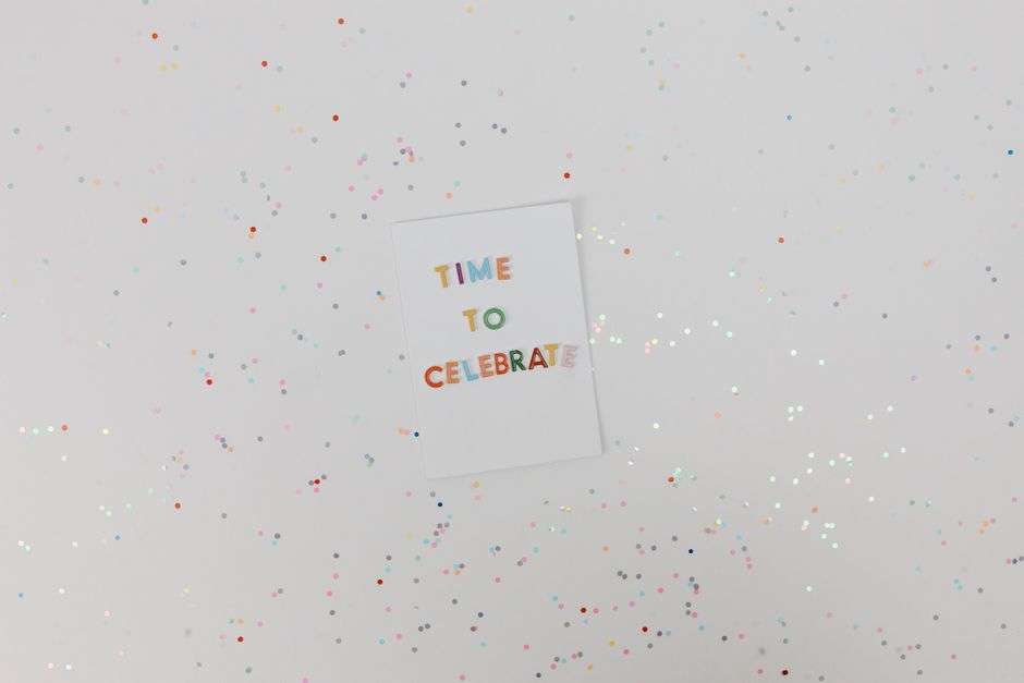 Festive celebration scene with confetti falling at a large indoor event