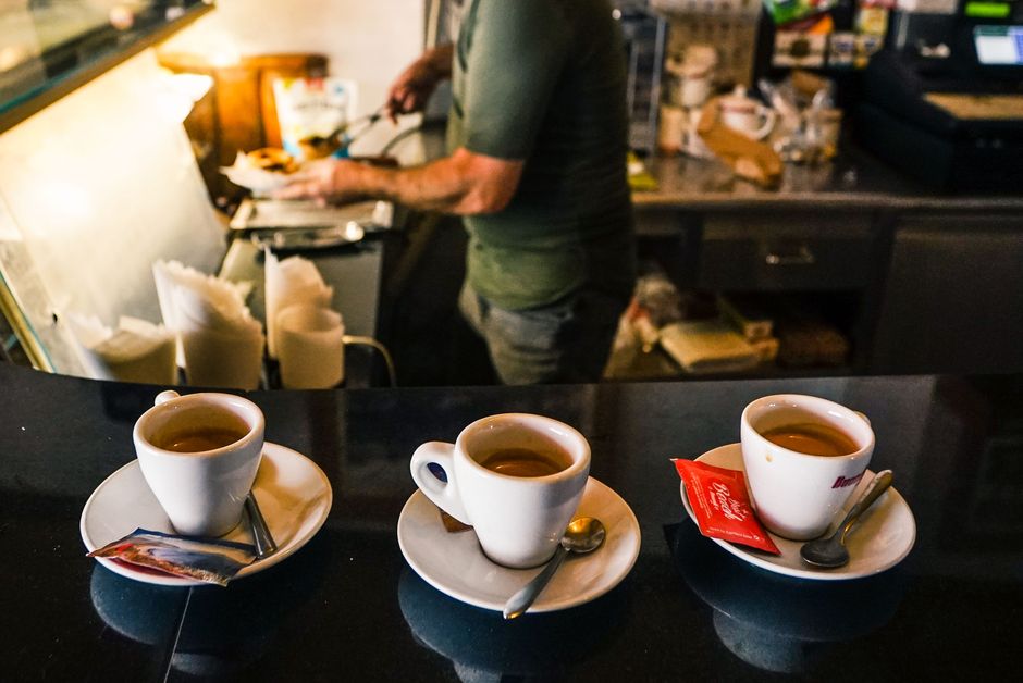 Freshly prepared cappuccino on the counter of a small locally owned coffee shop