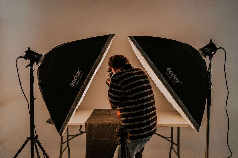 Professional studio lighting and camera equipment arranged for a product photography session