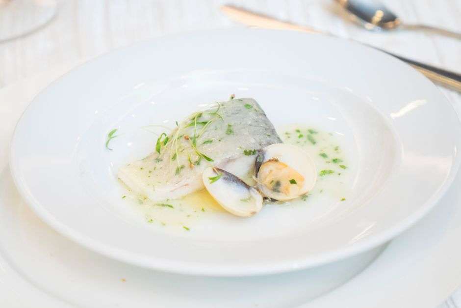 Elegantly plated seafood entree served at a cozy fine dining restaurant