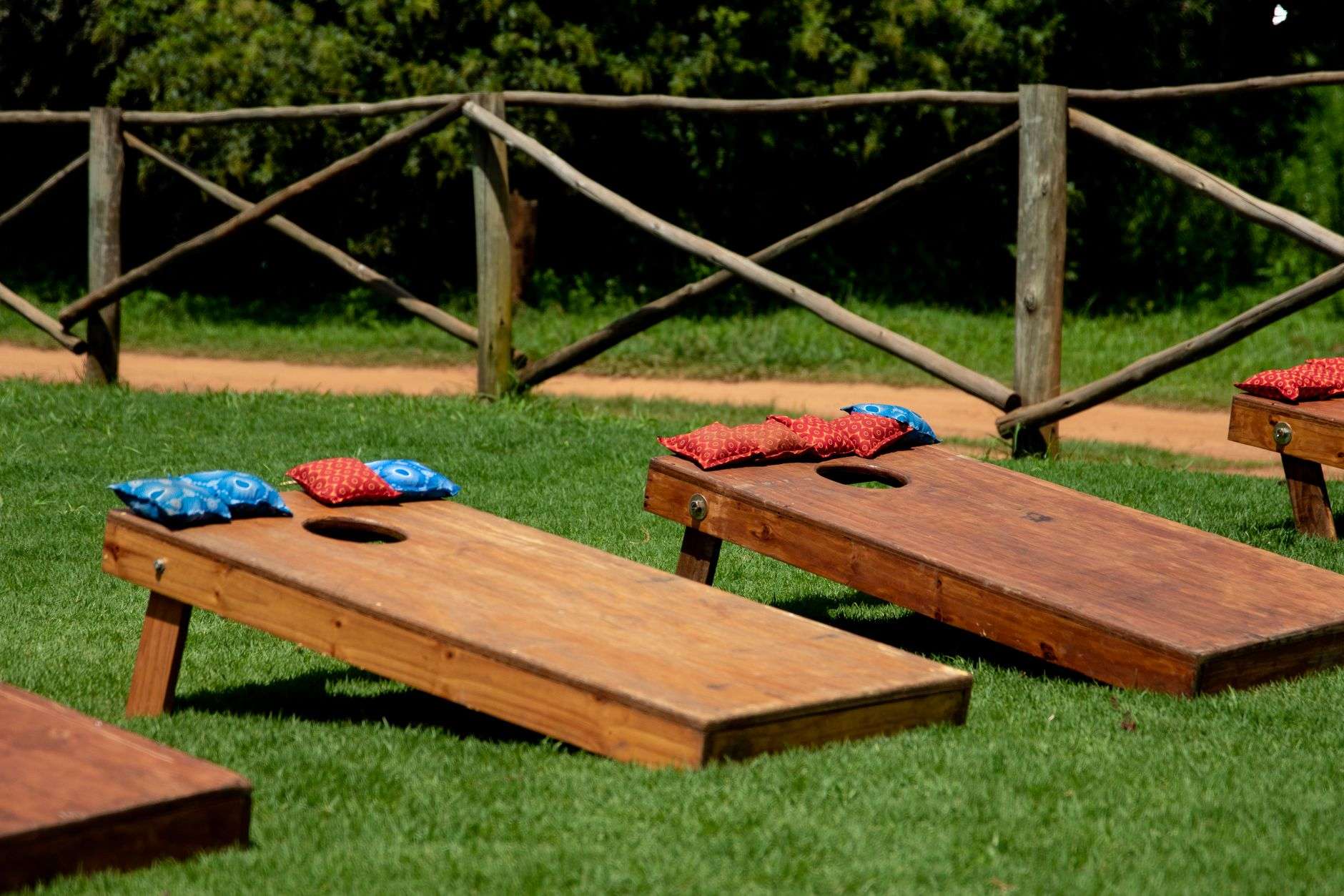 Cornhole boards set up for an outdoor tournament