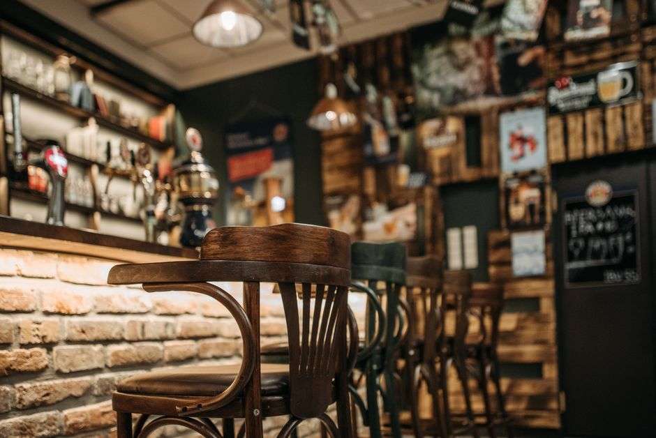 The interior of a historic bar decorated with antiques and vintage collectibles