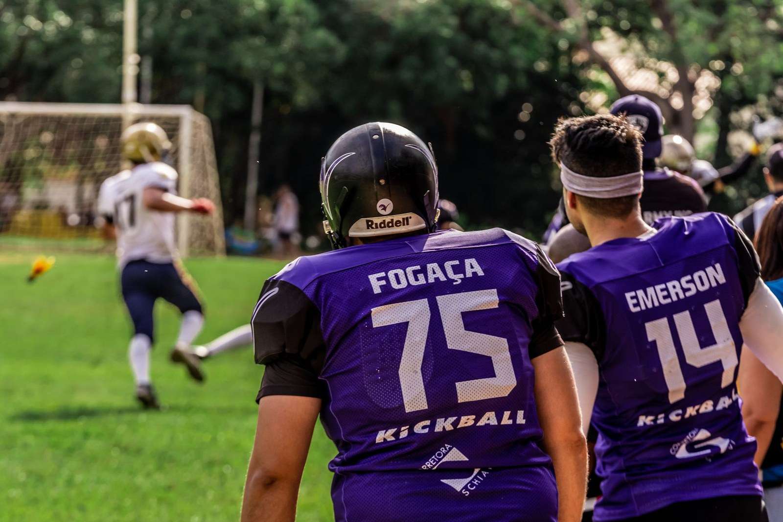 A football placekicker striking the ball on a field goal attempt