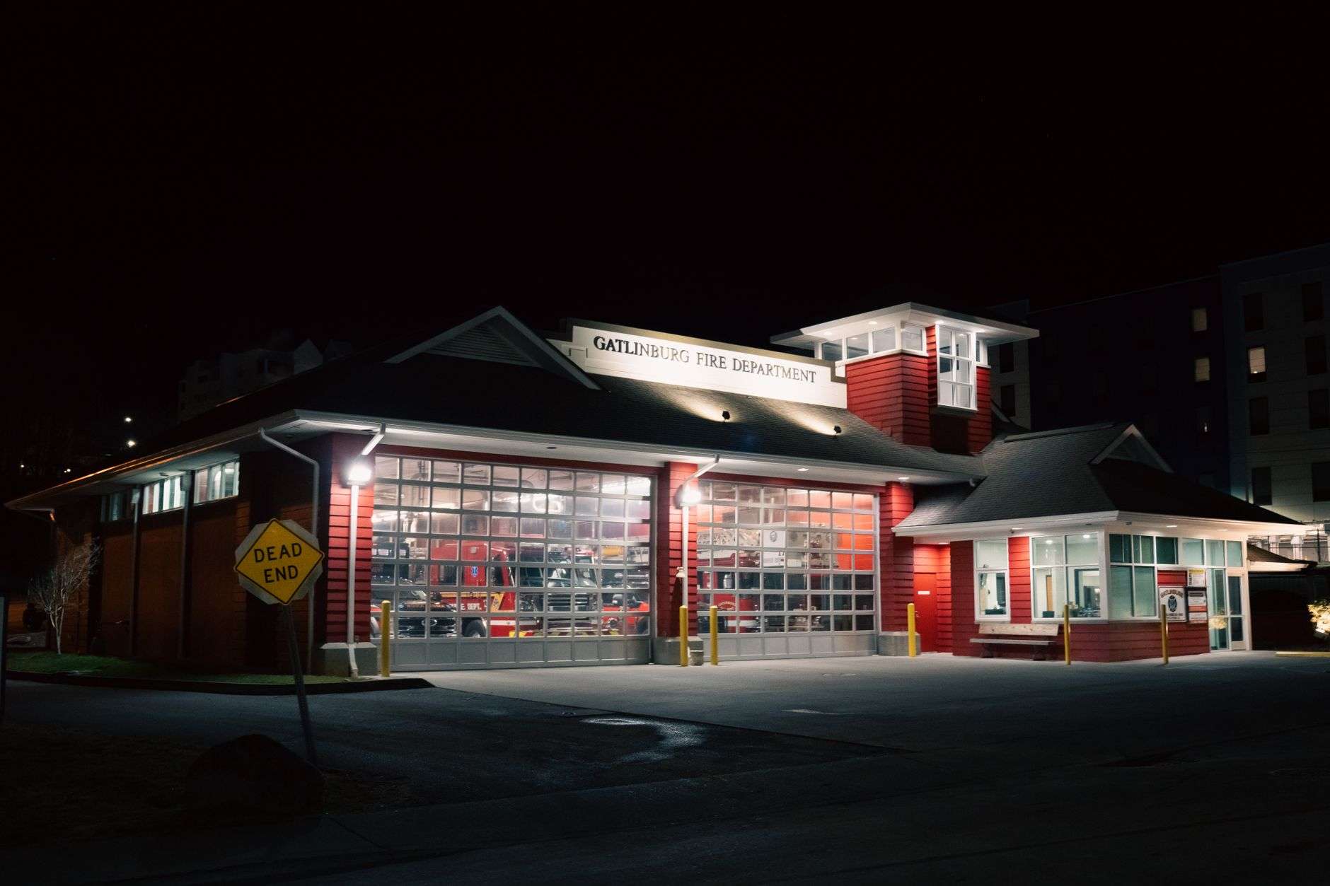 A fire engine with emergency lights on responding to a call