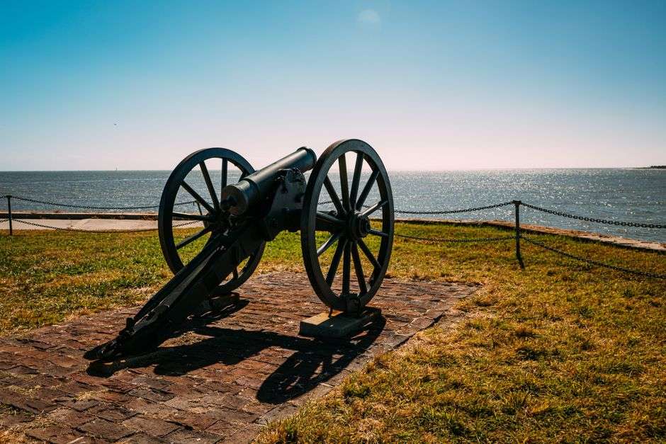 A historic cannon positioned on the walls of a colonial-era fort