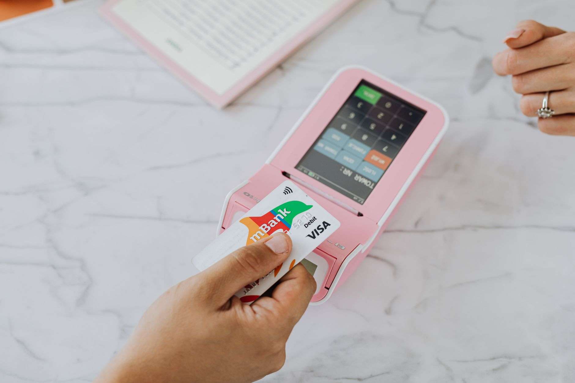 A person holding a credit card